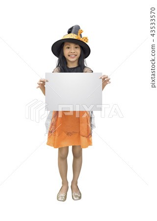 Girl in witch costume holding empty copyspace 43533570
