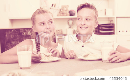 Girl and boy are eating 43534043
