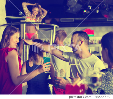 Female and male clubbing with cocktail in the club on party Female and male clubbing with cocktail in the club on party 43534589