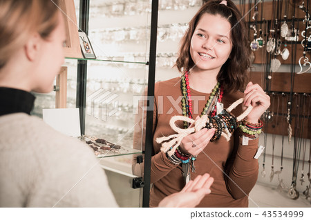 Female showing different bracelets 43534999
