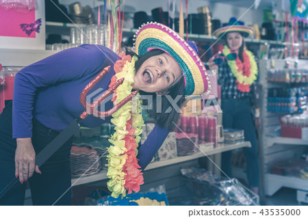 girl is trying things in store of festival outfits girl is trying things in store of festival outfits 43535000