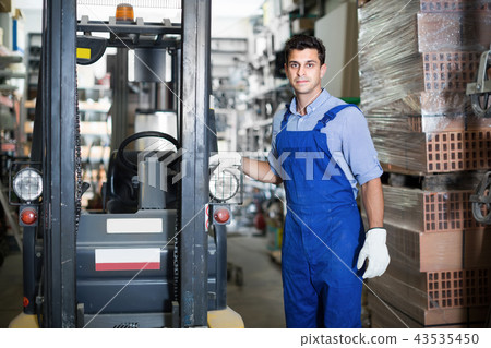 Portrait of adult sellerman in uniform in workplace 43535450
