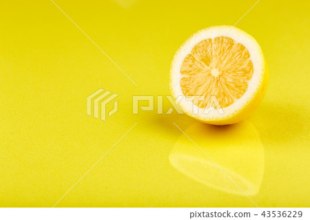 Section of lemon, yellow background Section of lemon, yellow background 43536229