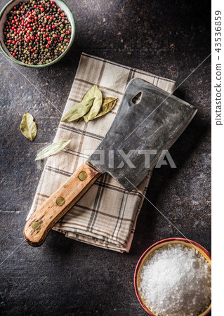 Old meat butcher on dark concrete board Old meat butcher on dark concrete board 43536859