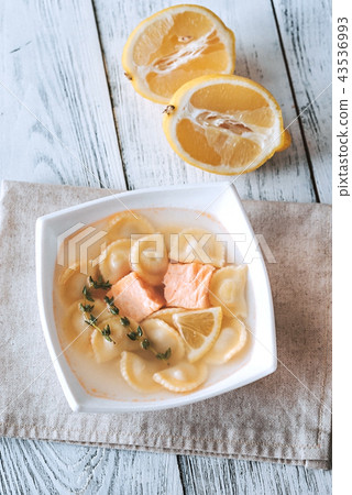 Portion of seafood ravioli soup Portion of seafood ravioli soup 43536993