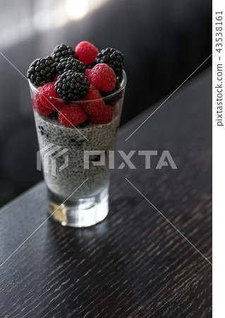 dessert of chia seed pudding in a glass vegan 43538161