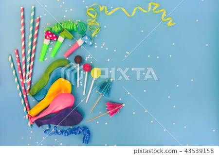 Candy, whistles, streamers, balloons on holiday Candy, whistles, streamers, balloons on holiday 43539158