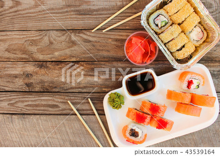 Rolls, wasabi, soy sauce, ginger on table. Rolls, wasabi, soy sauce, ginger on table. 43539164