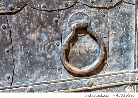 Antique cathedral metal door with doorknob Antique cathedral metal door with doorknob 43539556