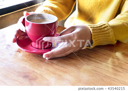 woman hands with coffee cup woman hands with coffee cup 43540215