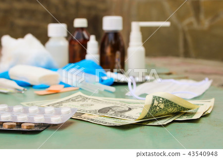 Medical items and money on table. Top view. 43540948