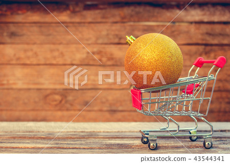 Shopping cart with christmas christmas ball. Shopping cart with christmas christmas ball. 43544341