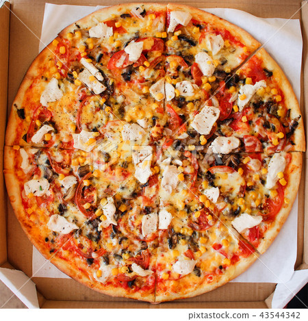 Closeup of pizza with chicken, tomatoes,  43544342