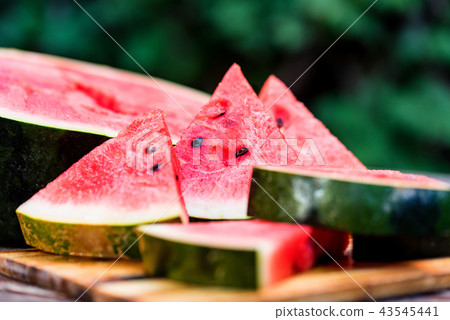 Slices of fresh watermelon on wooden board 43545441