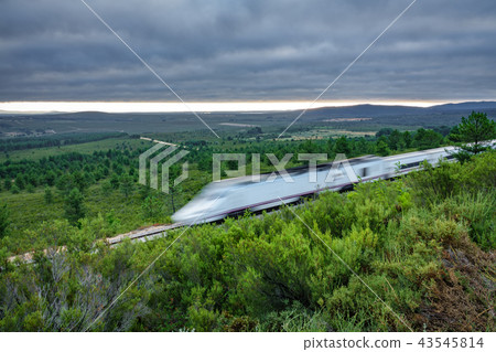 Railway and blurred fast train in the country at sunrise 43545814