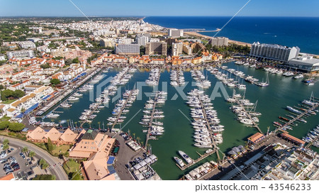 Aerial view of the bay of the marina, with luxury yachts in Vilamoura. Aerial view of the bay of the marina, with luxury yachts in Vilamoura. 43546233