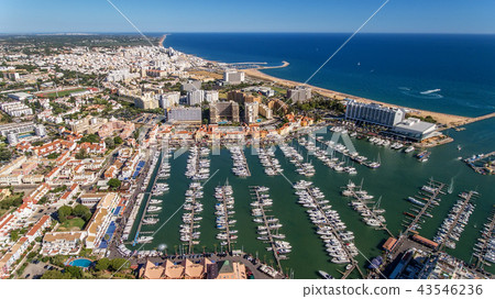 Aerial view of the bay of the marina, with luxury yachts in Vilamoura. 43546236
