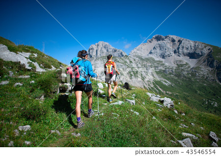 图库照片 trekking of two coworkers working in the mountains