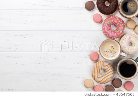 Coffee cups, donuts and macaroons 43547505