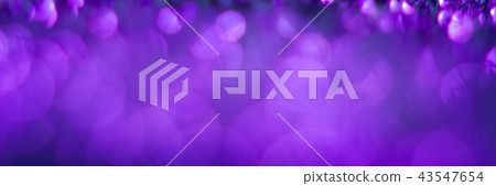 Violet bokeh on a black background. Defocused. Abstract background for your design. Free space for 43547654