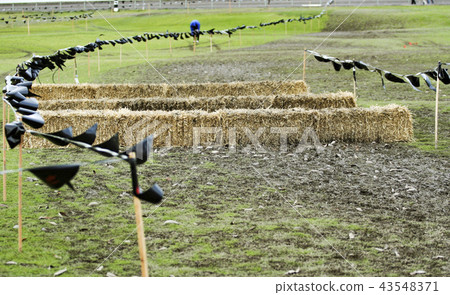 Cross country course with hay bales and markers Cross country course with hay bales and markers 43548371