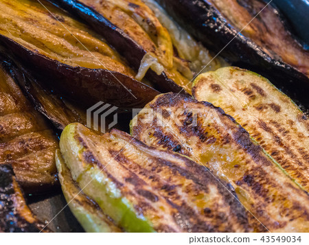 Courgettes, aubergines grilled closeup background Courgettes, aubergines grilled closeup background 43549034