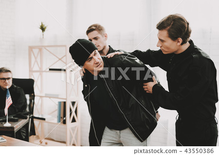 Police Officers Detainee Delivery On Questioning. Police Officers Detainee Delivery On Questioning. 43550386