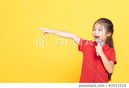 happy little girl speaking on yellow background happy little girl speaking on yellow background 43551519