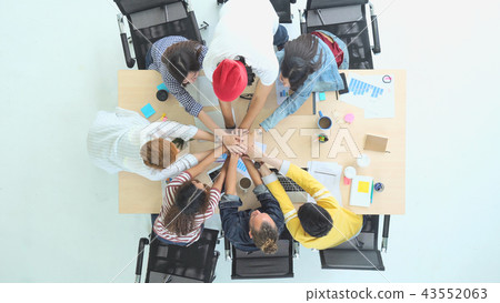 Top view scene of Asian and Multiethnic Business people with casual suit standing and Hand coordination with happy action for teamwork in the modern workplace, people business group concept Top view scene of Asian and Multiethnic Business people with casual suit standing and Hand coordination with happy action for teamwork in the modern workplace, people business group concept 43552063