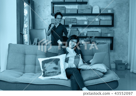 Couple asian teenager owner business people work at home for online shopping, checking the order of product in technology computer and laptop, entrepreneur and alpha generation life style concept Couple asian teenager owner business people work at home for online shopping, checking the order of product in technology computer and laptop, entrepreneur and alpha generation life style concept 43552097