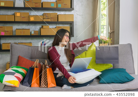 Asian teenager owner business people work at home for online shopping, happy action when got the product with laptop, entrepreneur and alpha generation life style concept Asian teenager owner business people work at home for online shopping, happy action when got the product with laptop, entrepreneur and alpha generation life style concept 43552098