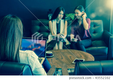 Reaw view of businesswomen using the computer over the couple of Asian Business women with casual suit brainstorm Meeting with looking at tablet In the coffee shop, business technology concept Reaw view of businesswomen using the computer over the couple of Asian Business women with casual suit brainstorm Meeting with looking at tablet In the coffee shop, business technology concept 43552102