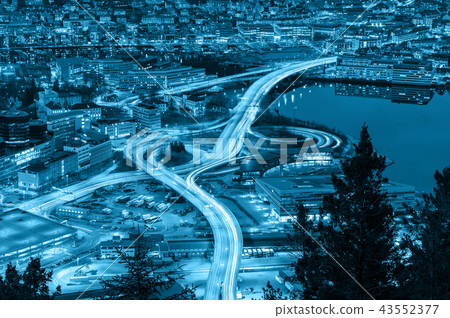 Top view express way with traffic light at the Bergen cityscape at the sunset time, Norway, transportation industrial concept, cool tone color Top view express way with traffic light at the Bergen cityscape at the sunset time, Norway, transportation industrial concept, cool tone color 43552377