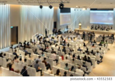 Abstract blurred photo of conference hall or seminar room with attendee background from top view, business and education concept Abstract blurred photo of conference hall or seminar room with attendee background from top view, business and education concept 43552383