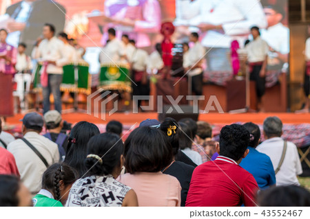 Rear side of Audiences sitting and listening the speackers on the stage; event and seminar concept 43552467