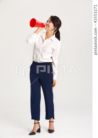 A twenties business woman communicating with the world. A loudspeaker, yell, A twenties business woman communicating with the world. A loudspeaker, yell, 43553271
