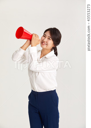 A twenties business woman communicating with the world. A loudspeaker, yell, A twenties business woman communicating with the world. A loudspeaker, yell, 43553273