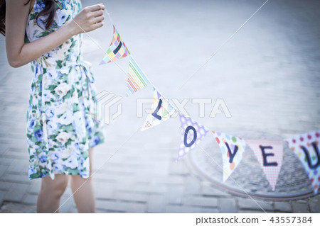 A woman holding a love car 43557384