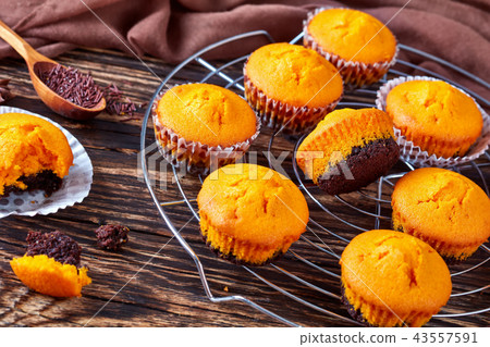 pumpkin muffins on a wooden table pumpkin muffins on a wooden table 43557591