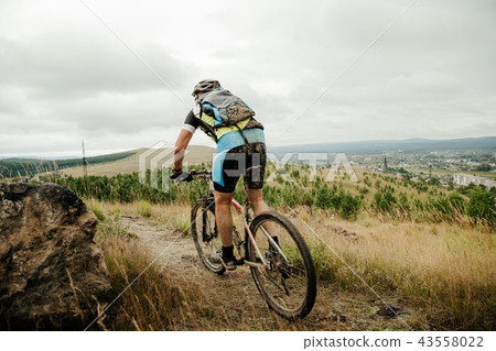 man cyclist with backpack 43558022