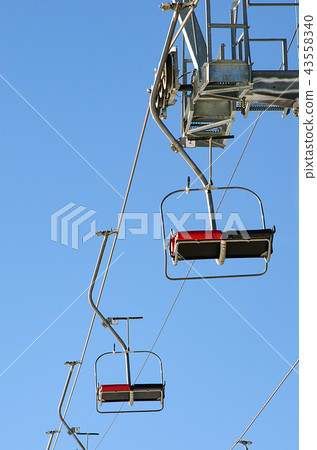 Empty seats of ski lift Empty seats of ski lift 43558340