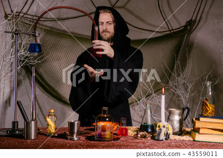 medieval alchemist scientist conducts a ritual  43559011