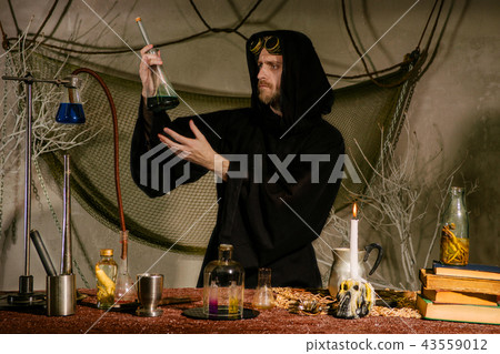 medieval scientist measures temperatures in flask medieval scientist measures temperatures in flask 43559012