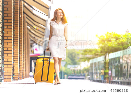 Girl traveler and suitcase Girl traveler and suitcase 43560318
