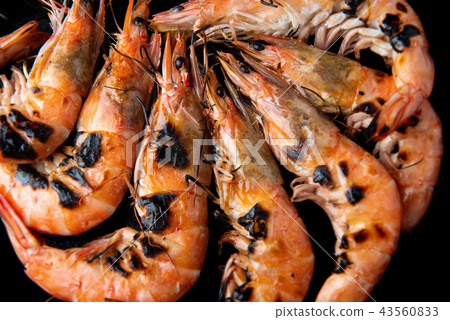 Grilled shrimp whith charcoal flaming fire. 43560833