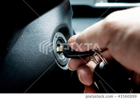 turning car key in hole to start the car engine turning car key in hole to start the car engine 43560899