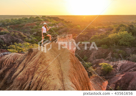 Young woman standing on top of the hill, Young woman standing on top of the hill, 43561656