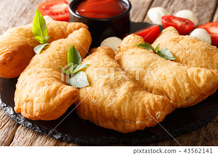 Italian fried donuts panzerotti close-up 43562141