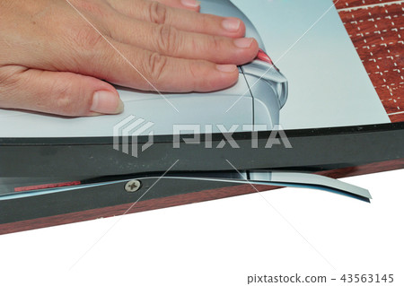 Hands take to cut paper by wooden guillotine 43563145