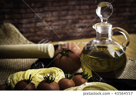 Olive oil and raw pasta Olive oil and raw pasta 43564557